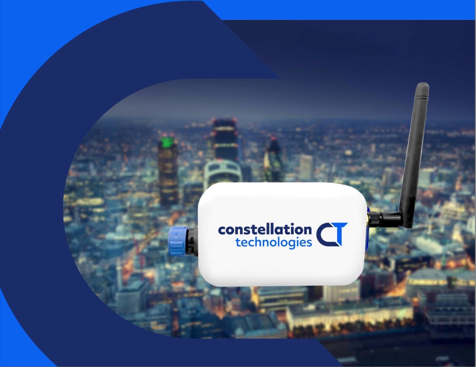 The Gen3 IoT smart device in front of a city skyline at night